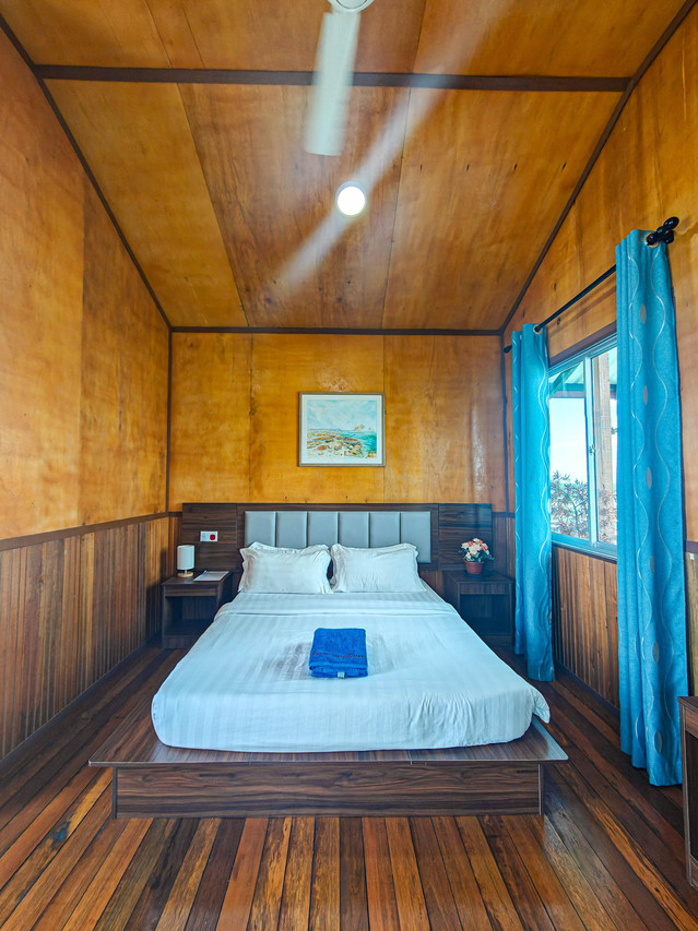 Bedroom with ocean view window Pavalintang Resort
