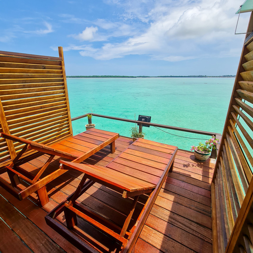 Private overwater lounging deck Pavalintang Resort