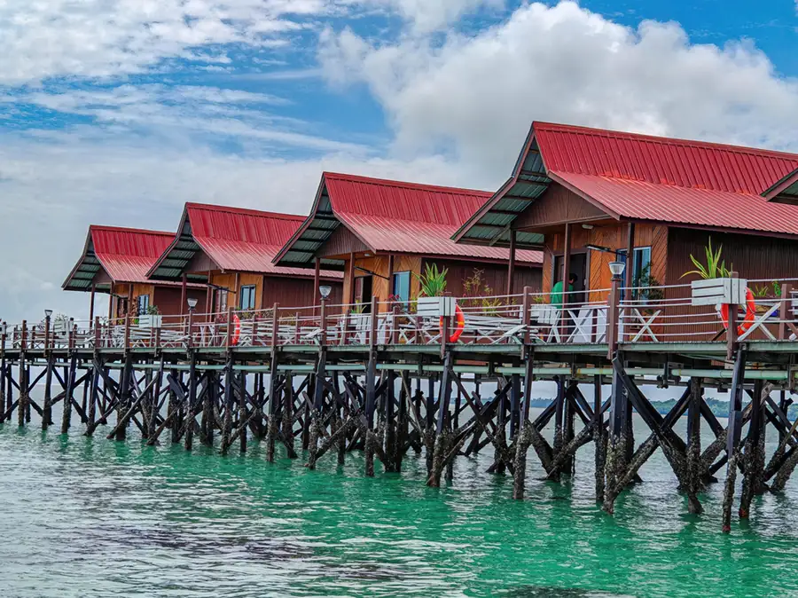 Perspective view of the overwater wooden chalets Pavalintang Resort